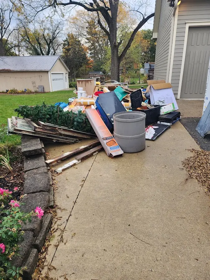 Dumpster being loaded with debris for Demolition Dumpster Rental in North Huntingdon